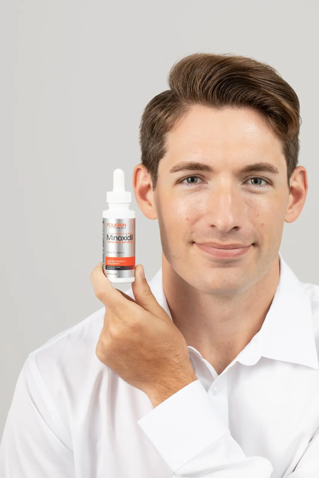 Man with FOLIGAIN® Minoxidil topical solution