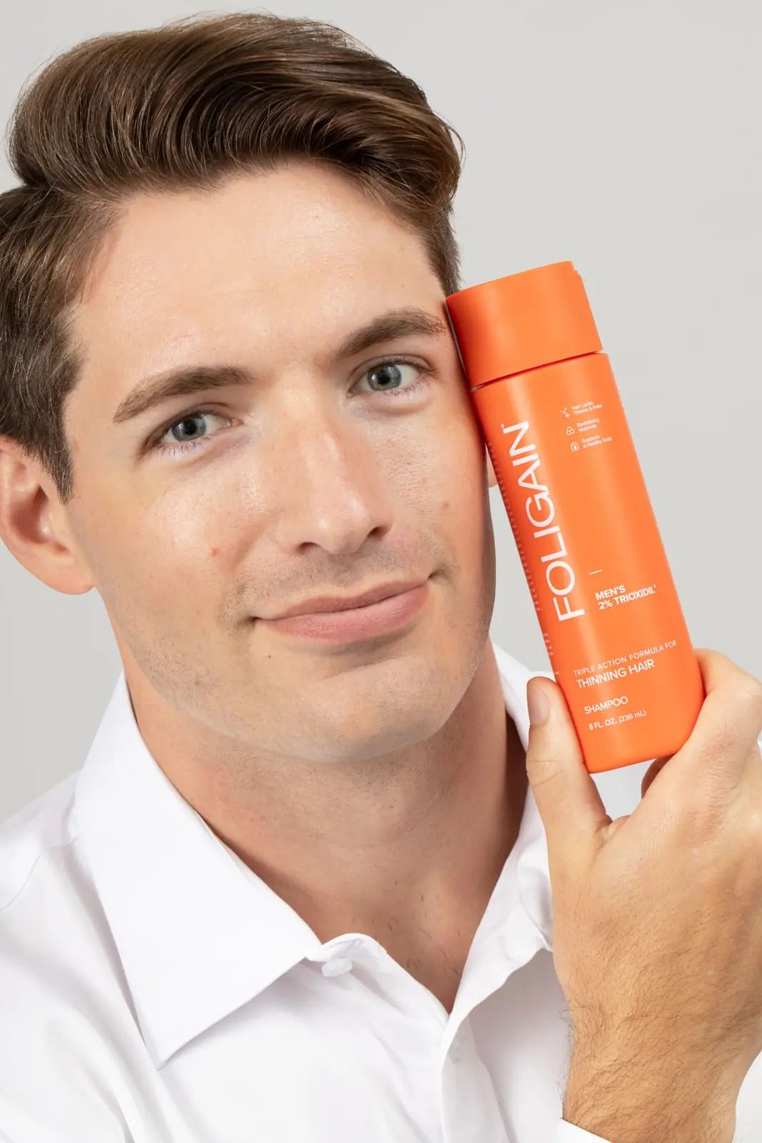 Man with FOLIGAIN® shampoo
