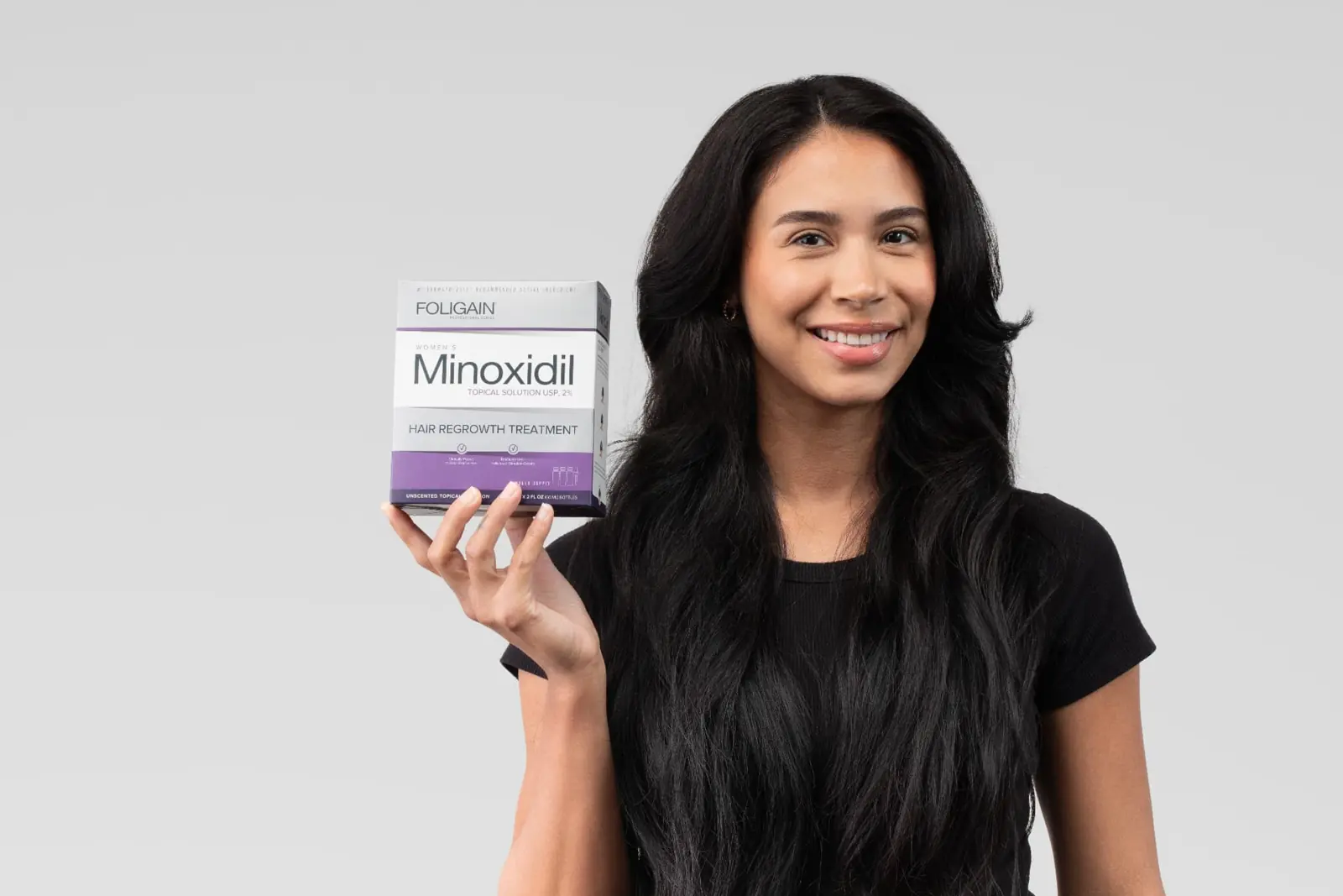 Woman with Minoxidil hair regrowth treatment